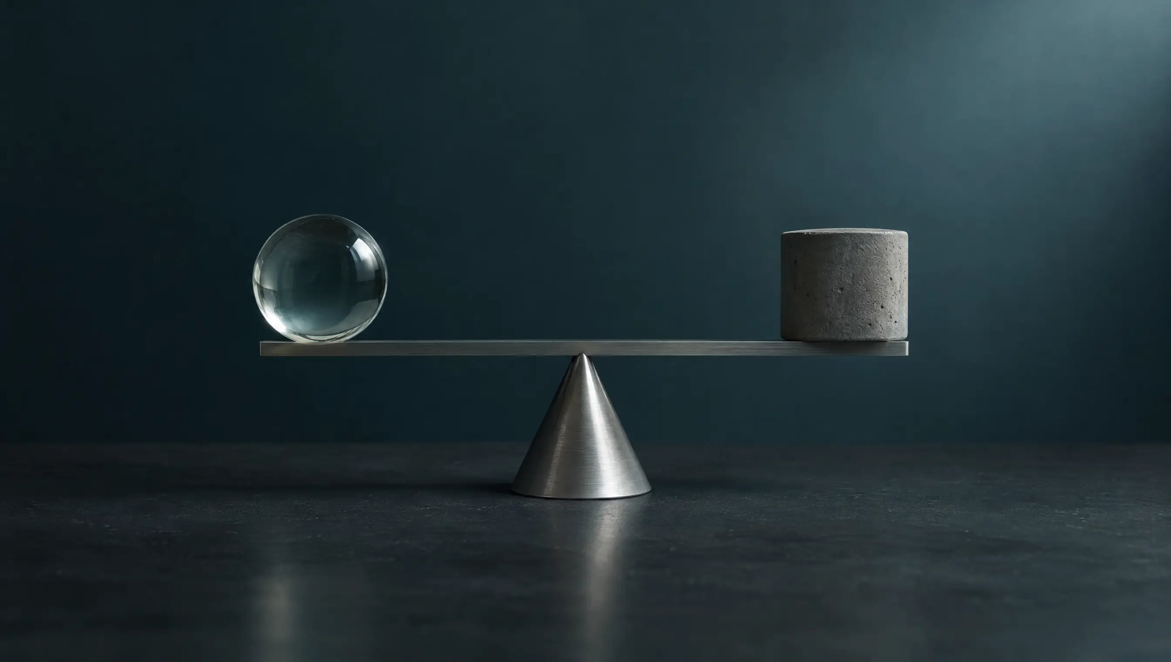 A glass sphere balanced against a concrete weight on a level metal scale