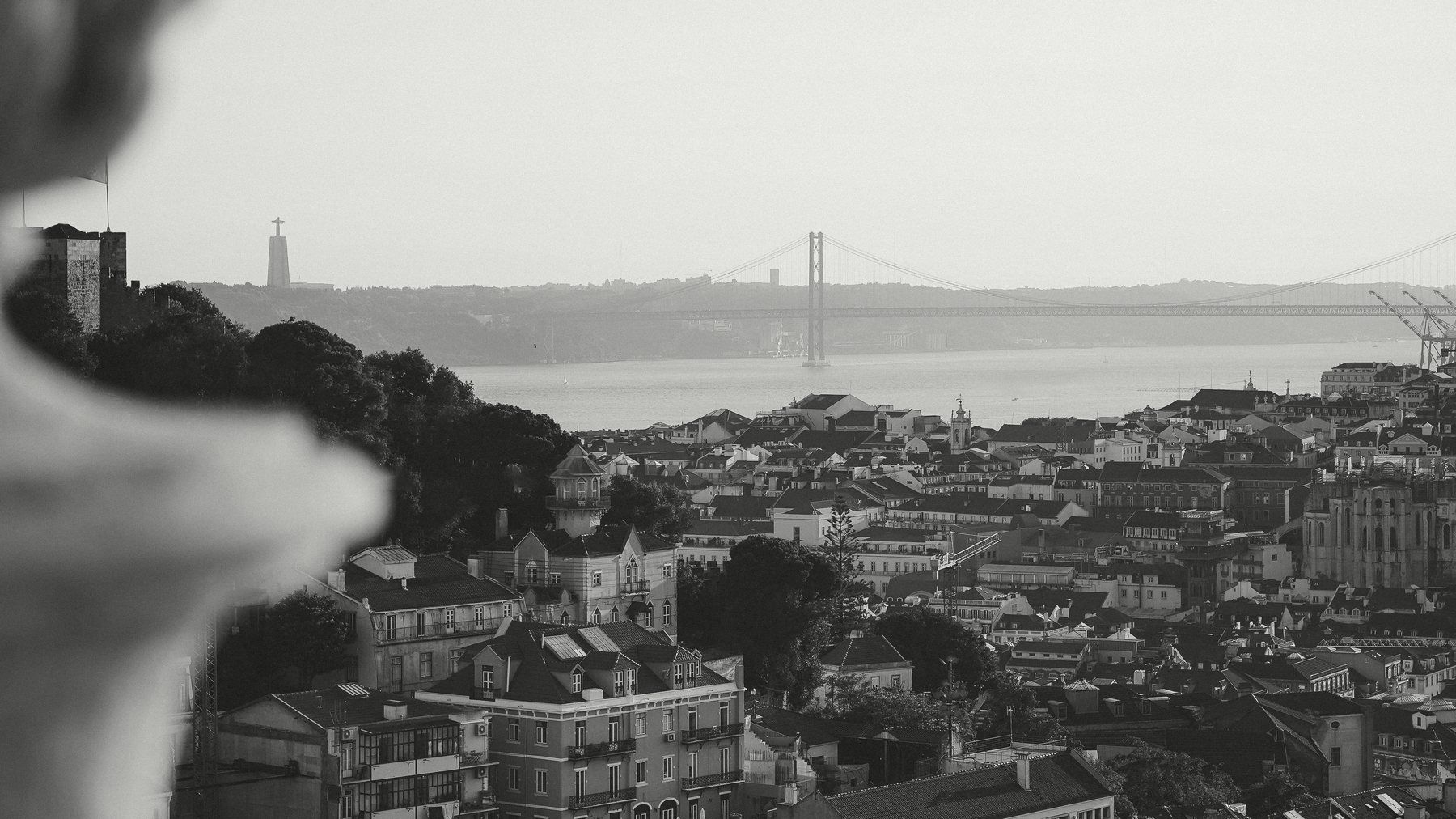 Lisbon rooftops and the river Tagus in the evening
