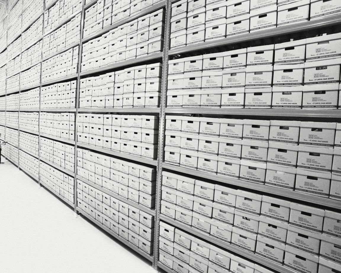 Long rows of archive boxes on tall shelves